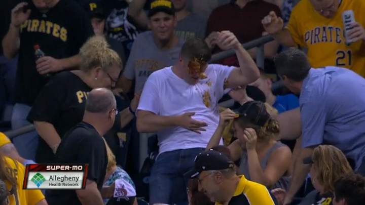 Dude tries to catch foul ball, loses beer, gets nachos all over his face