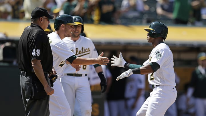 Butler, Davis power Athletics past the Tigers 12-3