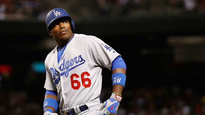 Yasiel Puig is wearing cleats with Vin Scully's face on them