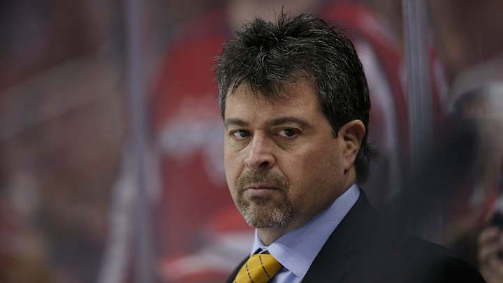 Watch: Islanders coach Jack Capuano takes puck to face