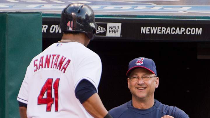 Carlos Santana and Terry Francona perform a kiss-filled pregame ritual