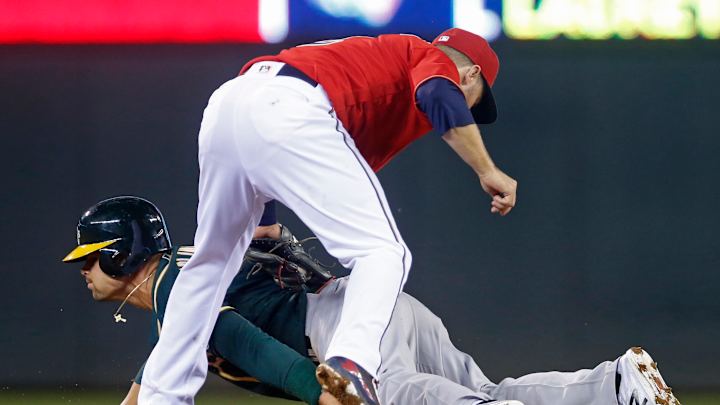 Milone, Twins power past A's in rain-delayed 11-4 victory