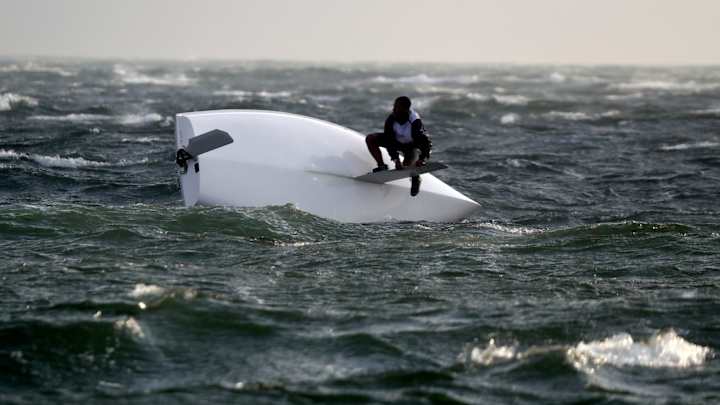 Rio holds its breath, then winds roar across Olympic courses