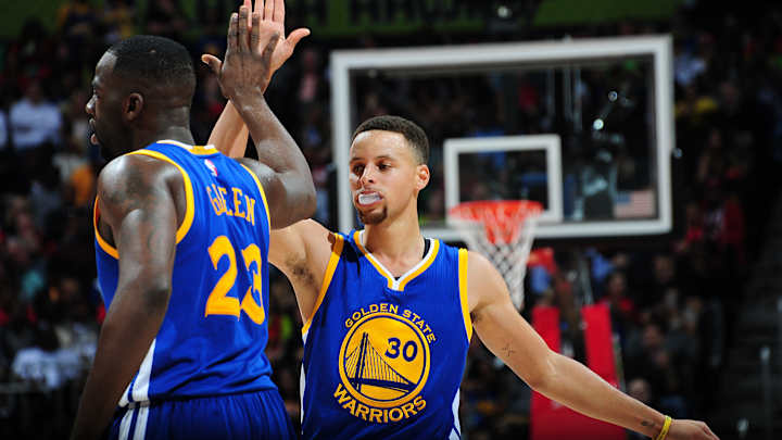 Curry leads Warriors to 50th win, 102-92 over Hawks