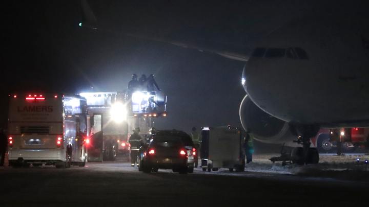 Vikings' plane slides off Wisconsin runway, struck for hours