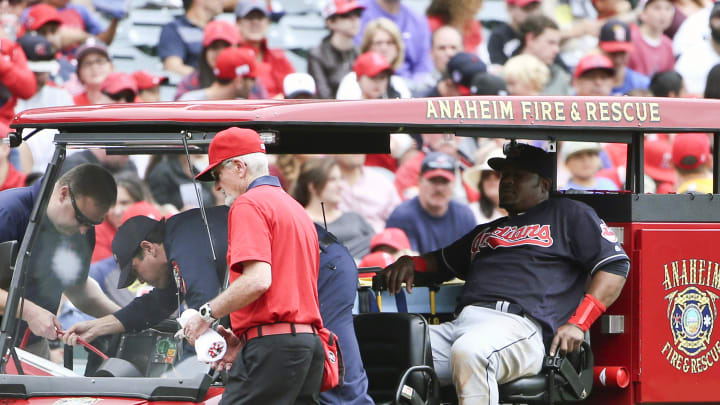 Indians' Uribe leaves on cart after low blow from grounder
