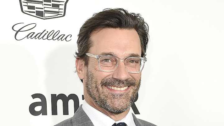 Jon Hamm is still at Wrigley Field wearing a Cardinals hat