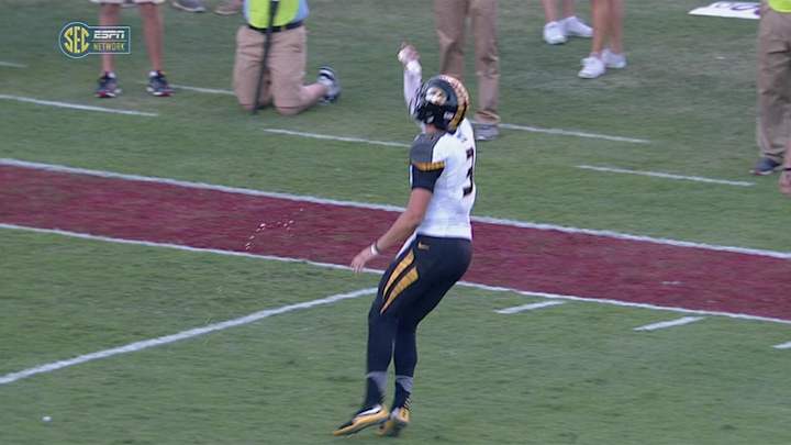 South Carolina students throw water bottle at Missouri QB Drew Lock, who drinks from it