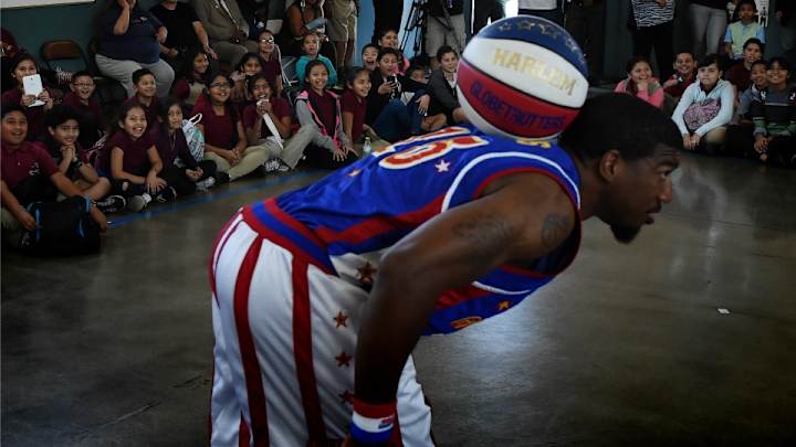 Globetrotters get some help from a 107-year-old woman