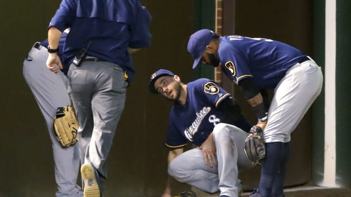 Ryan Braun sprains knee, ankle after crashing into wall Ryan Braun sprains knee, ankle after crashing into wall