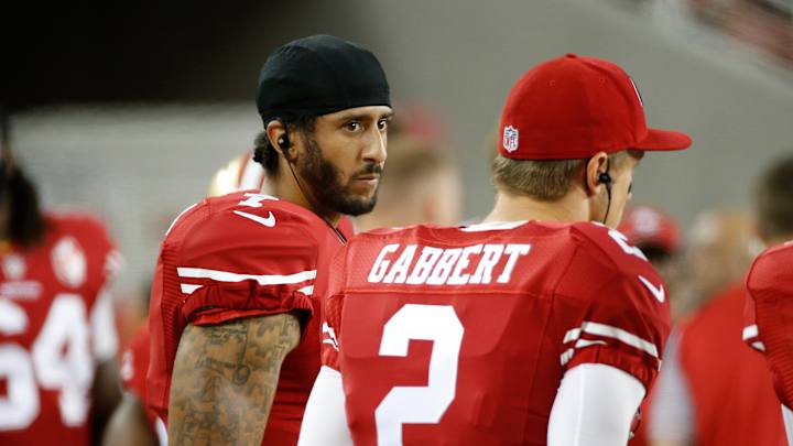 Niners QB Kaepernick refuses to stand for anthem in protest
