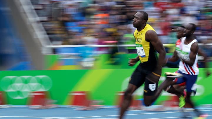 Four on the floor for Simone Biles; Bolt coasts in 200 heat