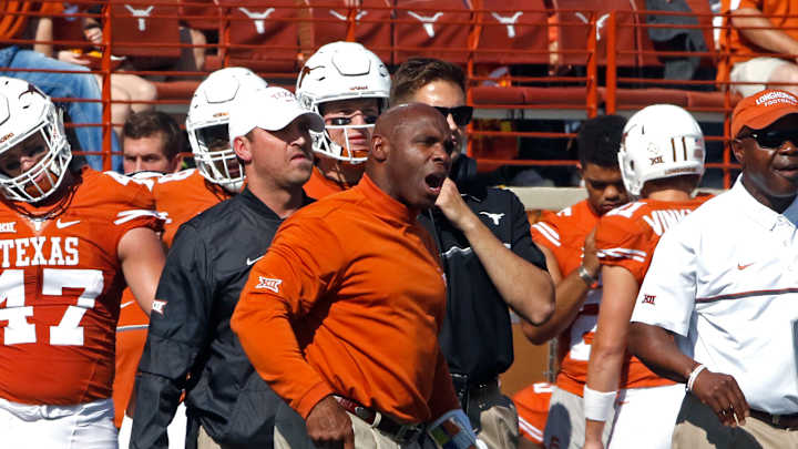Embattled coach Strong leads Texas in trip to Kansas