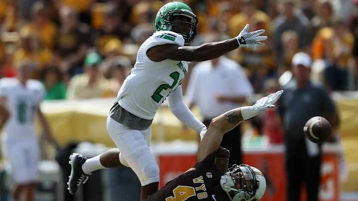 Santiago with 2 touchdowns; North Dakota beats Wyoming 24-13