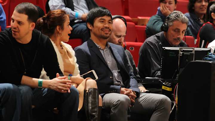 Mayweather, Pacquiao swap numbers, meet at Miami hotel