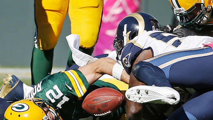 Rodgers' streak ends, D lifts Packers in 24-10 win over Rams