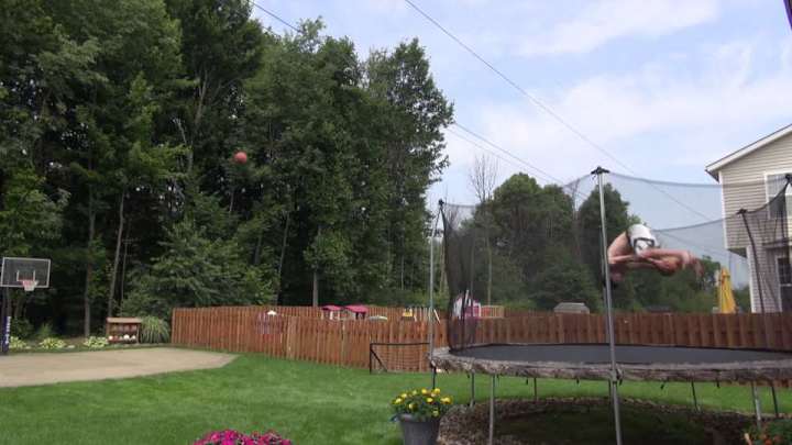 Amazing trick shot involves two flips, two basketballs and one hoop