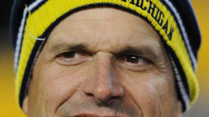 Harbaugh discusses football dreams, helmet stickers
