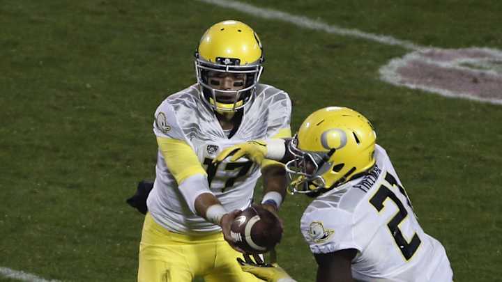Oregon holds off Colorado 41-24 on soggy night