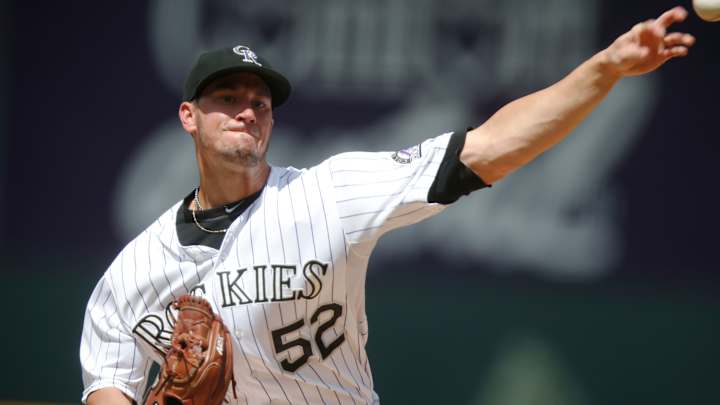 Rusin tosses complete game as Rockies beat Padres, 5-0.