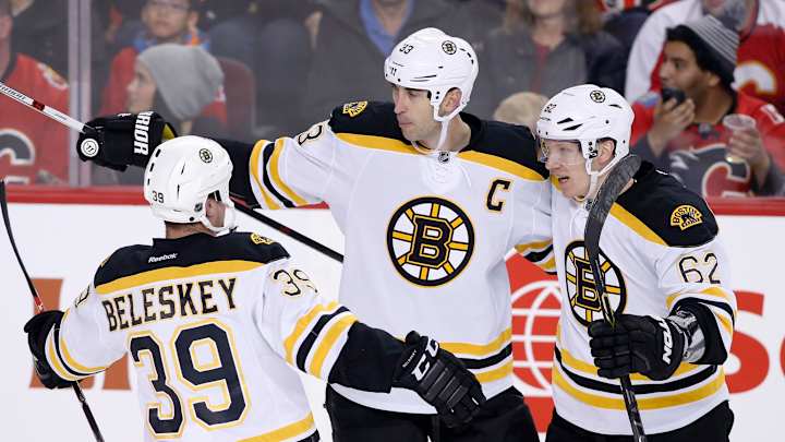 Gaudreau finishes hat trick in OT, Flames beat Bruins 5-4