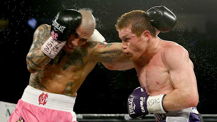 Canelo Alvarez beats Miguel Cotto by decision, wins middleweight title