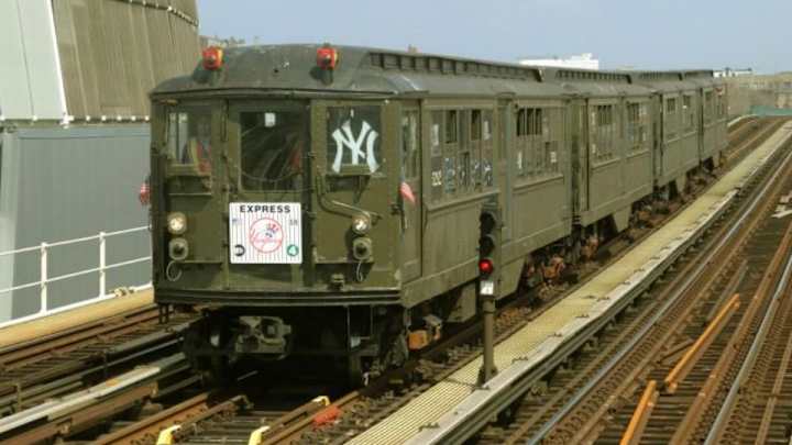 Fans ride a 1917 subway train to Yankee Stadium for Opening Day