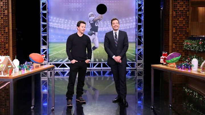 Watch Mark Wahlberg throw random objects in place of footballs Watch Mark Wahlberg throw random objects in place of footballs