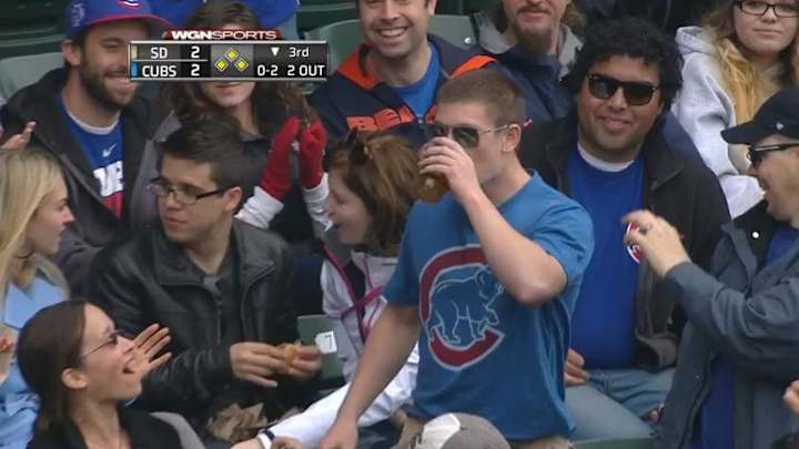 Cubs fans keep chugging beers with foul balls floating in them