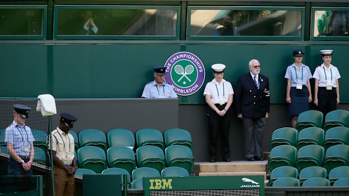 The Latest: Wimbledon begins with minute's silence