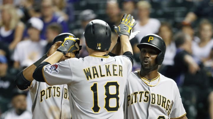 Pirates clinch playoff spot with 13-7 win over Rockies