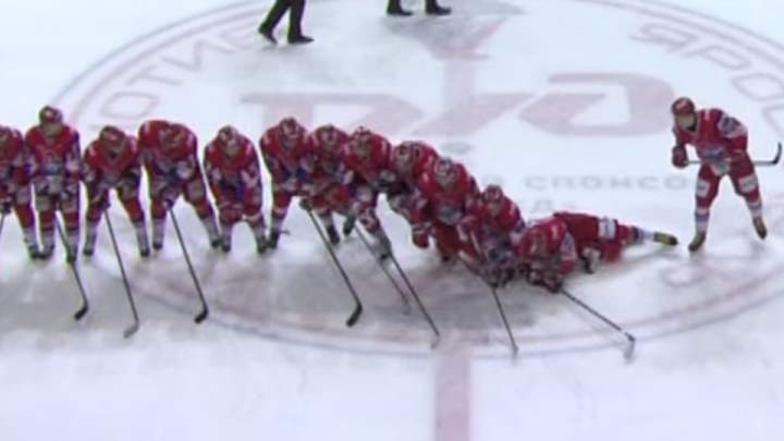 Russian hockey team celebrates with human domino routine