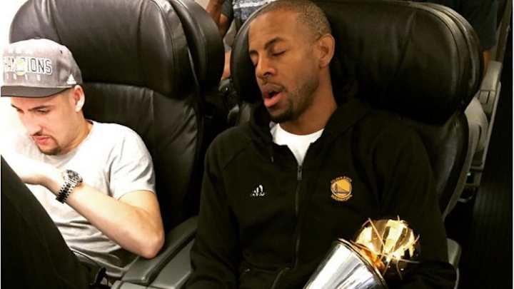 Andre Iguodala holds MVP trophy close on Warriors plane ride home