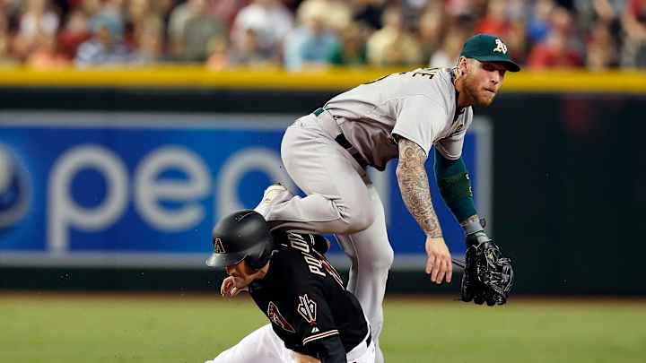 Vogt atones for mistakes, leads A's past Arizona 3-2