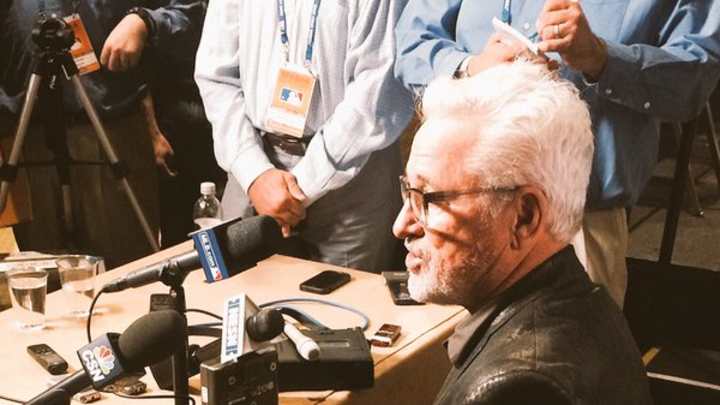Please look at Cubs manager Joe Maddon’s snakeskin jacket