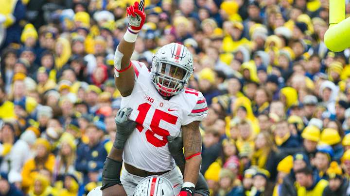 Buckeyes beat Michigan 42-13, but lose spot in title game