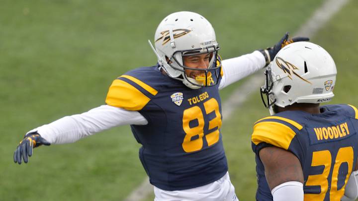 No. 22 Toledo stays unbeaten with 63-20 romp over E Michigan