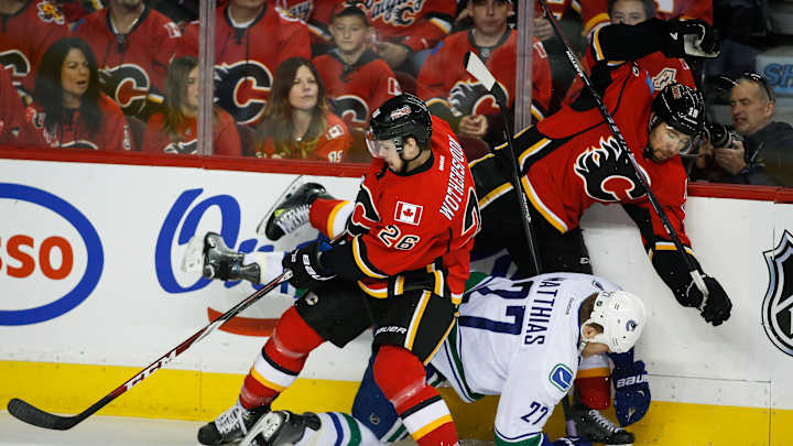 Flames beat Canucks 7-4 to advance in Stanley Cup playoffs