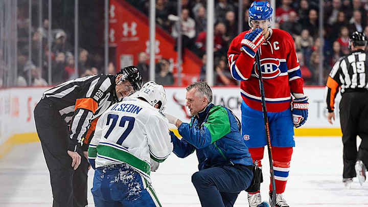 Canucks’ Daniel Sedin takes brutal high stick in 1st period, scores in 2nd Canucks’ Daniel Sedin takes brutal high stick in 1st period, scores in 2nd