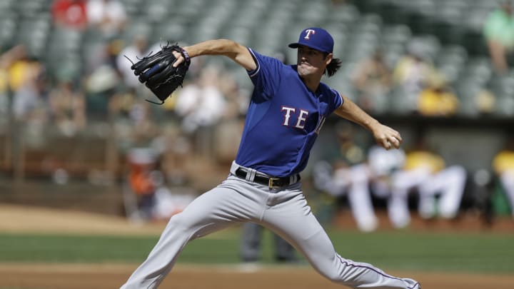 Hamels sharp as Rangers complete sweep of A's 8-1