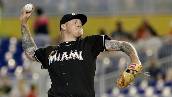 Latos, Stanton lead Marlins to 4-1 win over Rockies