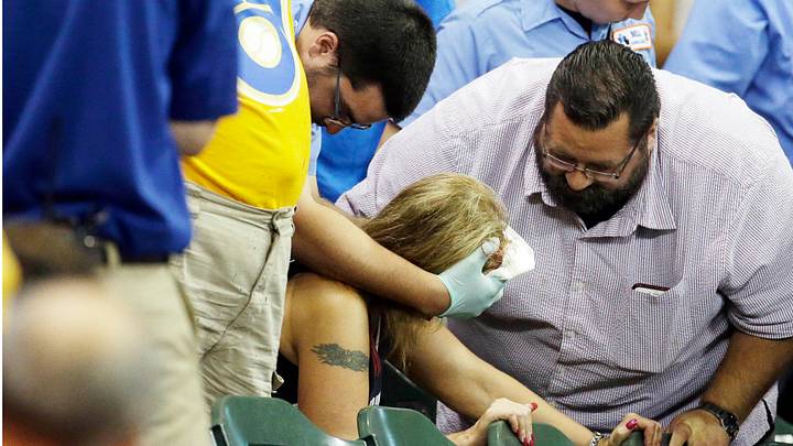 Fan hit in face by line drive during Braves-Brewers game Fan hit in face by line drive during Braves-Brewers game