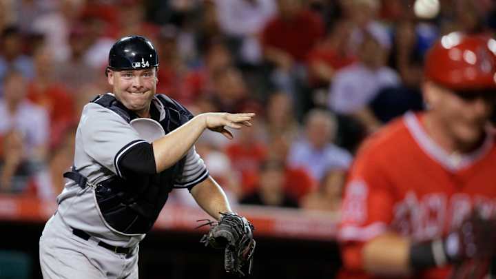 Pujols homers, Heaney deals in Angels' 2-1 win over Yankees