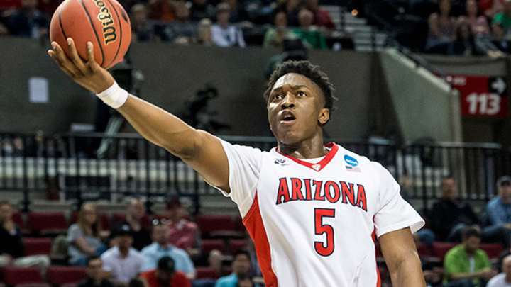Arizona's Stanley Johnson guided by his mother on and off the court