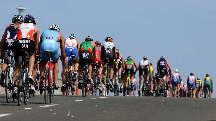 Watch: Cycling fan prevents crash by removing bike from course