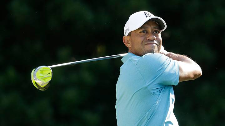 Woods celebrates a big putt and a chance to play