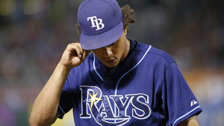 Lewis wins 13th as Rangers beat Rays 12-4