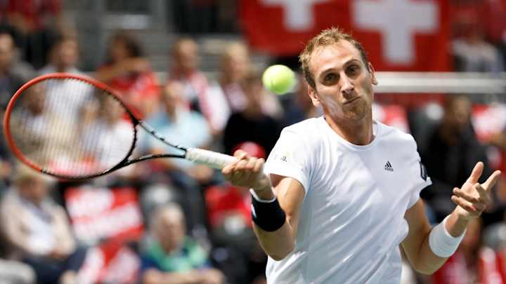 Federer win in singles lifts Swiss to Davis Cup playoff win
