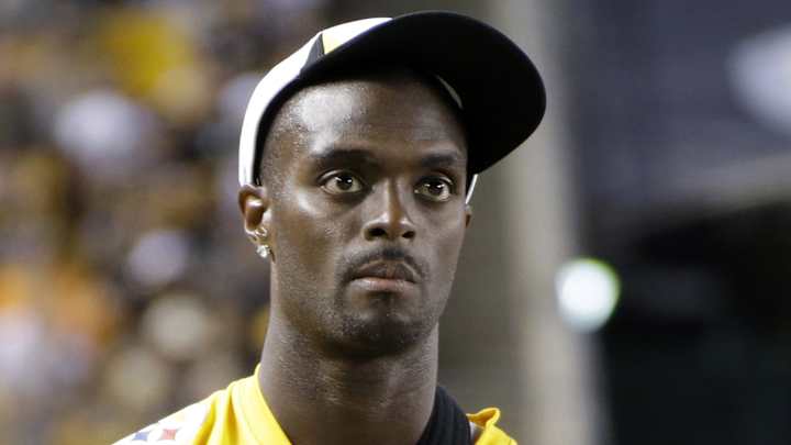 Former NFL star Plaxico Burress pleads guilty to tax evasion