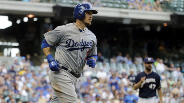 Grandal drives in 8, homers twice as Dodgers rout Brewers
